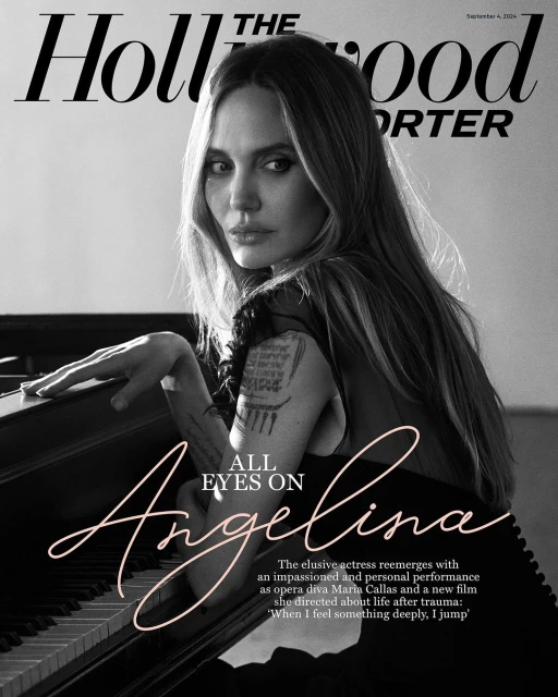 Black and white magazine cover featuring Angelina Jolie with long hair and fair skin in soft light, with piano keyboard detail.