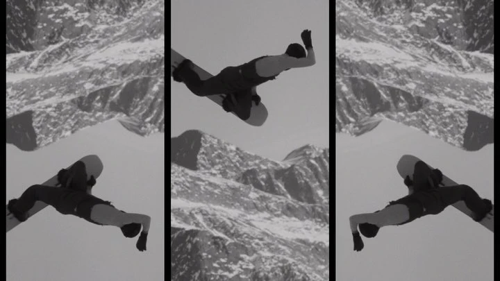 A snowboarder catches air mid-jump against a monochrome mountain backdrop, captured in a triptych-style composition.