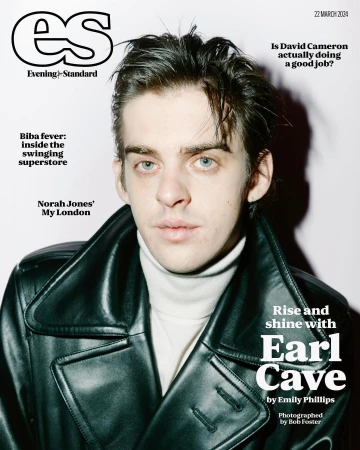 Evening Standard magazine cover featuring Earl Cave in a black leather trench coat, turtleneck sweater, and slicked-back dark hair.