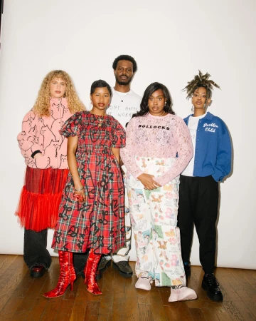 Group of five diverse models posing against a white studio backdrop shot by photographer Bob Foster.