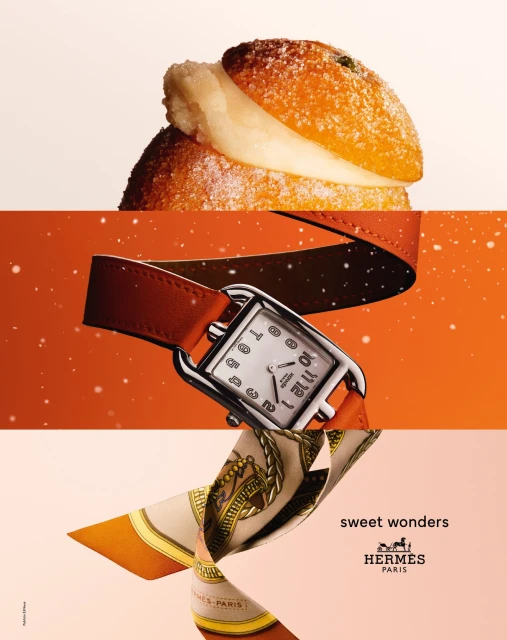 Still life featuring an orange pastry, a women's wristwatch with an orange strap, and a silk scarf, set against gradient backgrounds.
