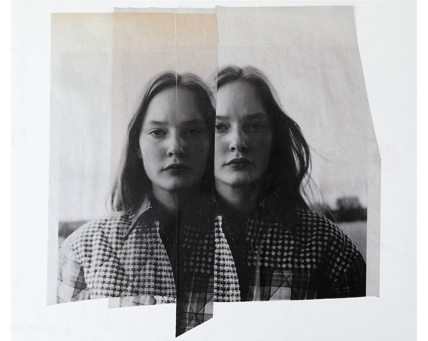 Monochrome art print features two women's faces on vertically-aligned paper. The women have long hair and are wearing checkered tops.