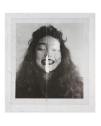 Portrait of a smiling woman with dark curly hair and dark lipstick by photographer Boe Marion.