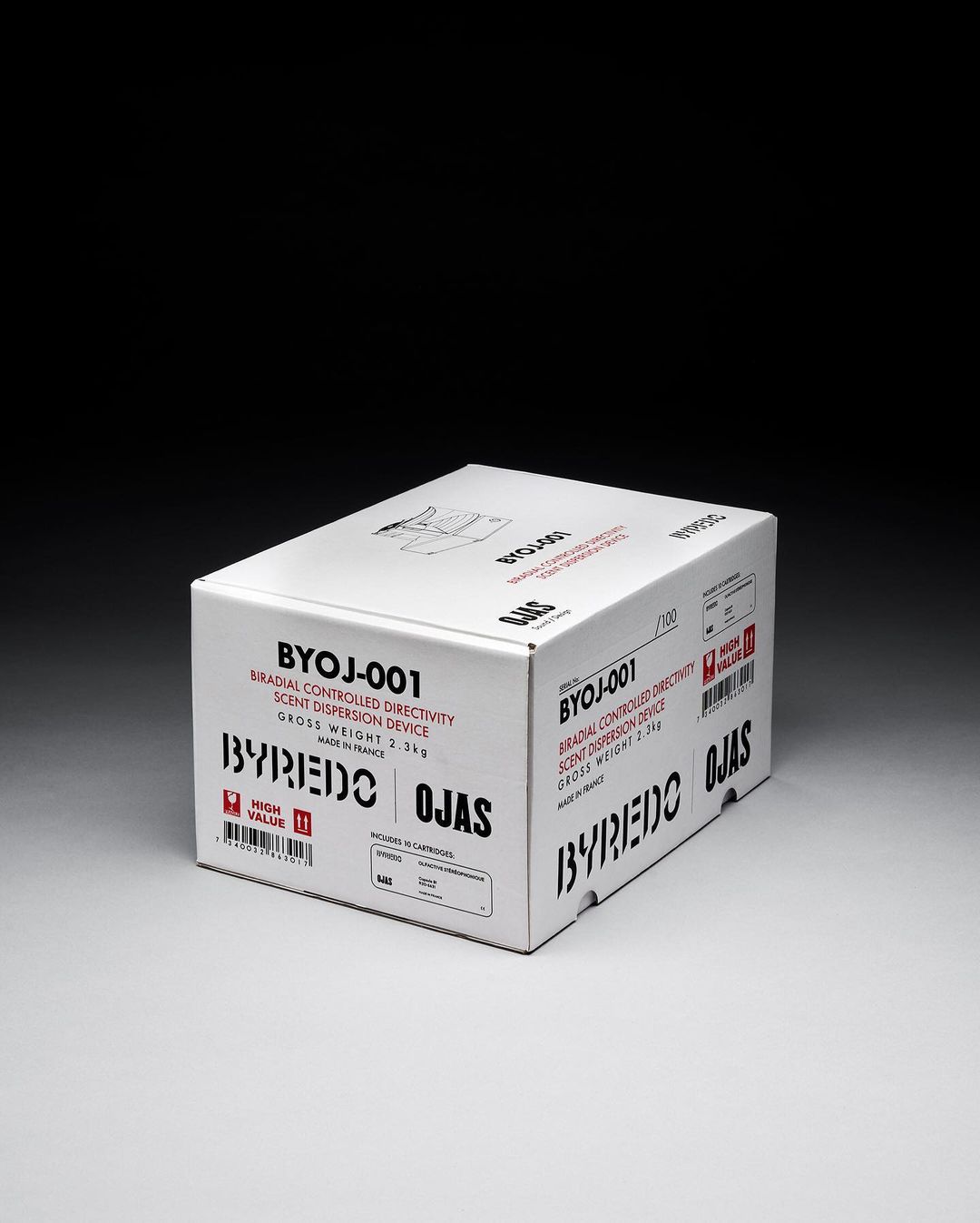 A white cardboard box for a Byredo Ojas radial controlled directivity scent dispersion device, displayed on a neutral surface against a dark background.