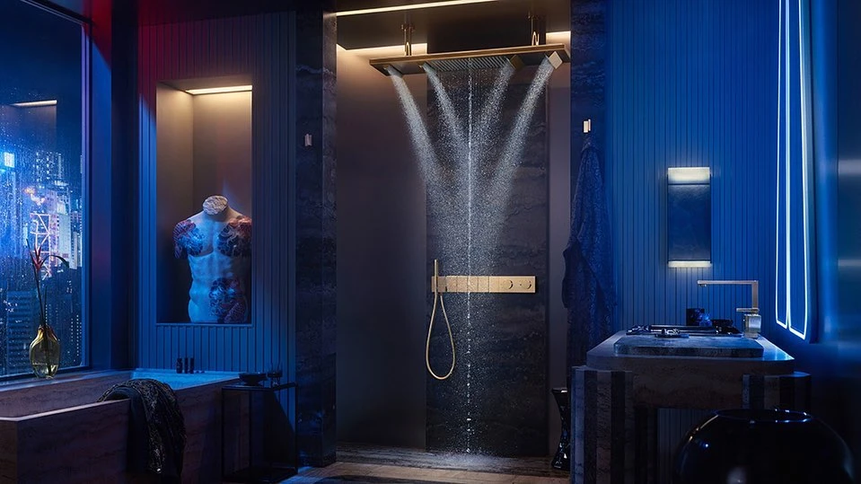 Modern bathroom interior featuring a luxurious shower with running water, marble surfaces, and blue lighting. Indoor residential setting.