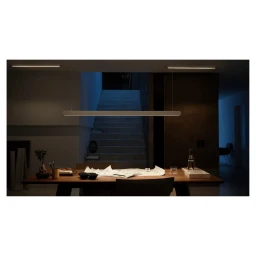 Interior dining table and stairs illuminated by minimalist pendant lighting photographed by Bohman+sjostrand