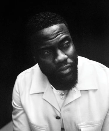 Monochrome portrait of a Black man with short hair and a beard wearing a collared button-up shirt by Bolade Banjo