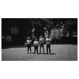 Four people holding basketballs standing on an outdoor asphalt court in New York directed by Bon Duke