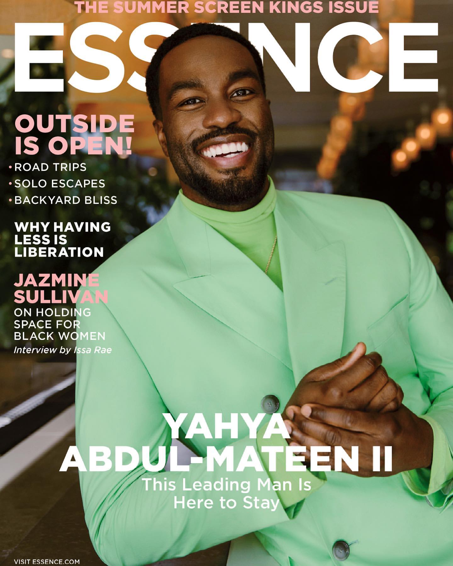 Essence magazine cover featuring Yahya Abdul-Mateen II, wearing a light green suit and smiling against a blurred background.