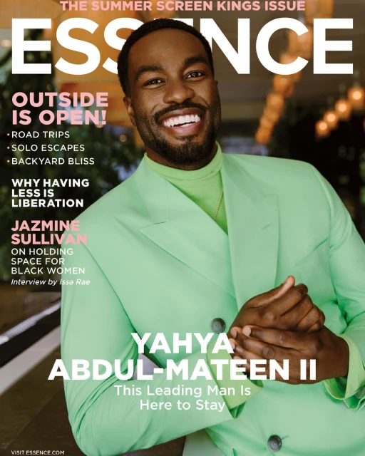 Essence magazine cover featuring Yahya Abdul-Mateen II, wearing a light green suit and smiling against a blurred background.