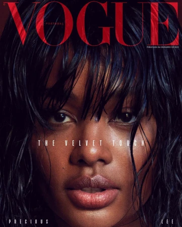 Close-up portrait of a woman with wet dark hair and neutral expression for Vogue Portugal by Branislav Simoncik