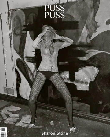 Black and white portrait of Sharon Stone on a magazine cover, posing in front of abstract art with fishnet stockings and heels.