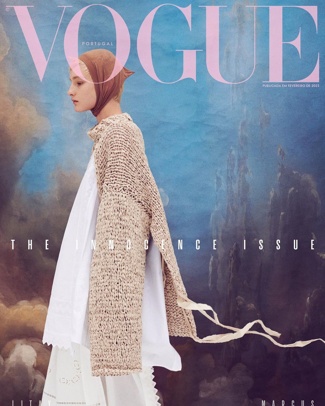 Vogue Portugal cover featuring a model in a headscarf, white dress, and knitted sweater, set against a painterly backdrop.