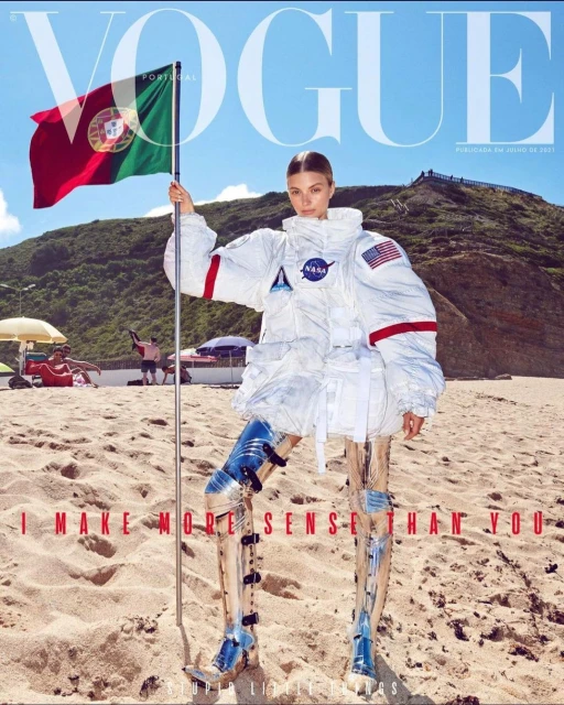 Vogue Portugal magazine cover featuring a woman in an astronaut suit on a beach, holding the Portuguese flag. Sky and ocean backdrop.