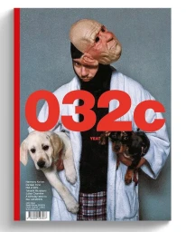 Man wearing a lifelike bald mask and white bathrobe holding two dogs against a grey textured background.