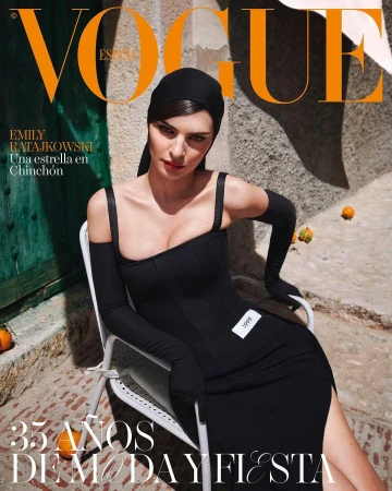 Vogue España cover featuring Emily Ratajkowski in a black dress, headscarf, and gloves sitting on a white chair outdoors.