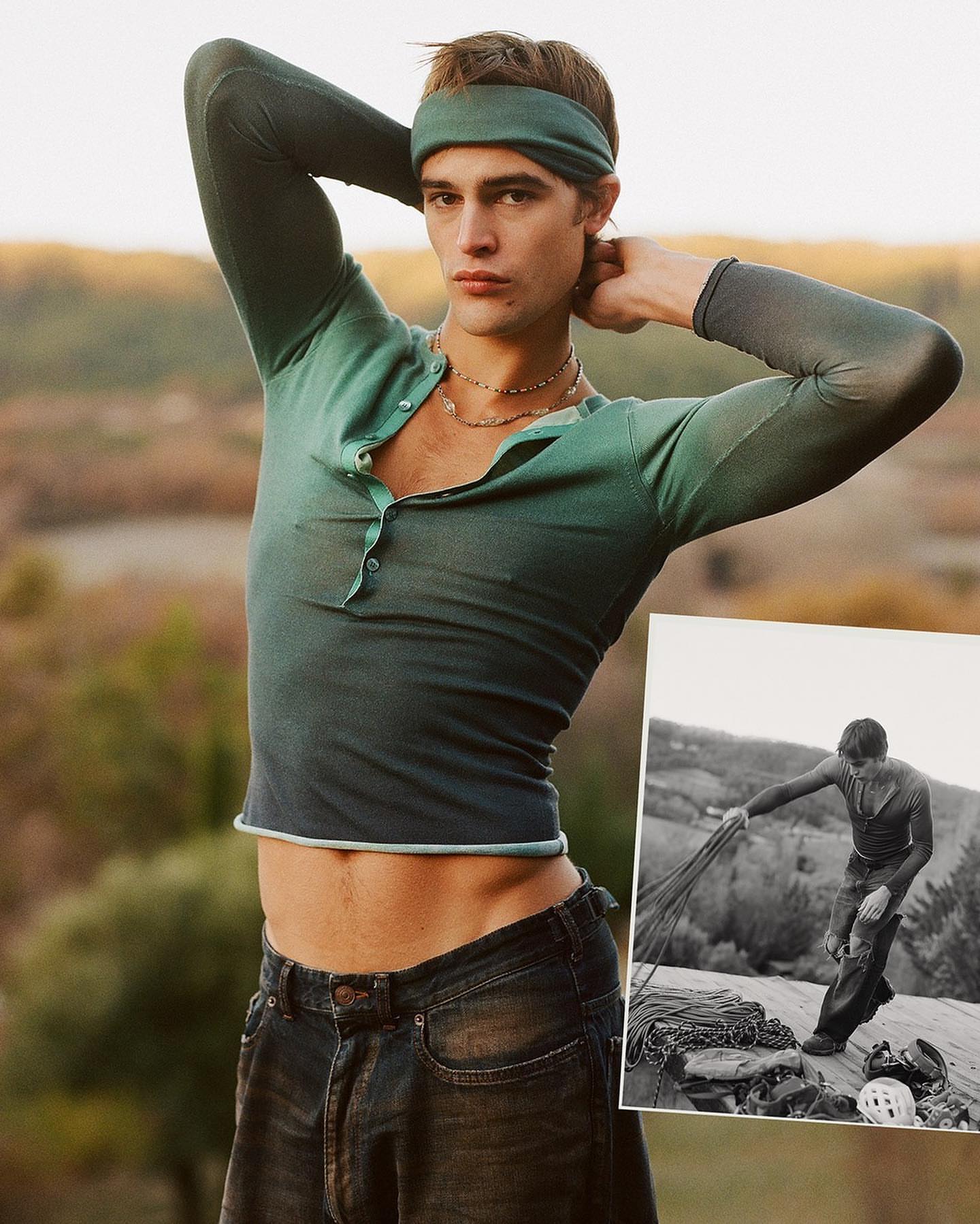 Male model poses outdoors wearing a green top and headband, against a blurred natural background and a black and white climber inset.