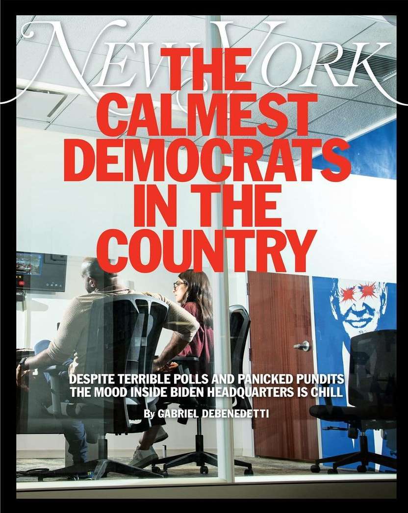 Magazine cover featuring two people seated in an office setting, behind a glass wall, with large red title text above them.
