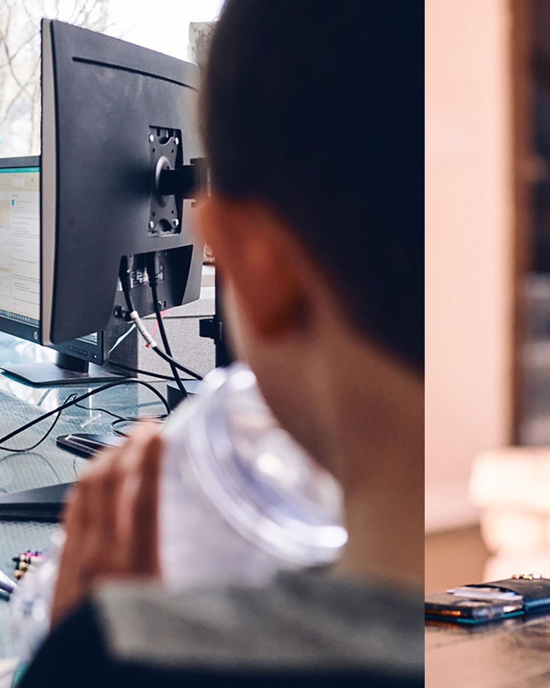 Person drinking water, working on a computer in a home office setting. Black monitors, cables, and a clear water bottle are visible.