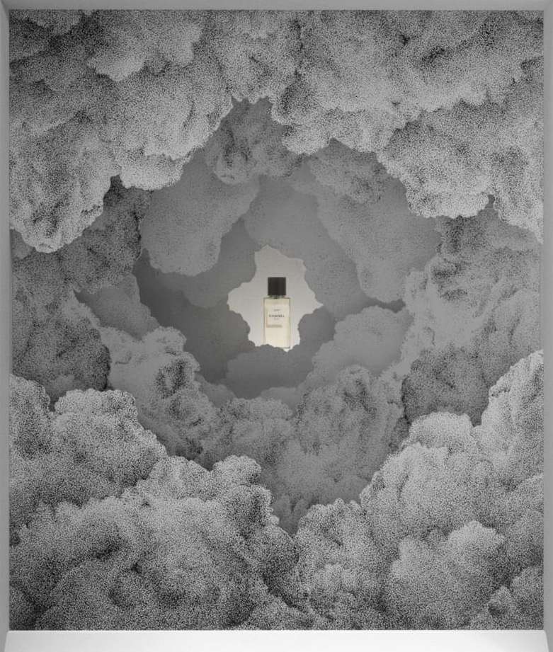 Perfume bottle surrounded by clouds in a monochrome studio shot. The focus is on the bottle, set against an abstract, dreamy cloudscape.
