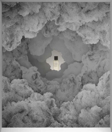 Perfume bottle surrounded by clouds in a monochrome studio shot. The focus is on the bottle, set against an abstract, dreamy cloudscape.
