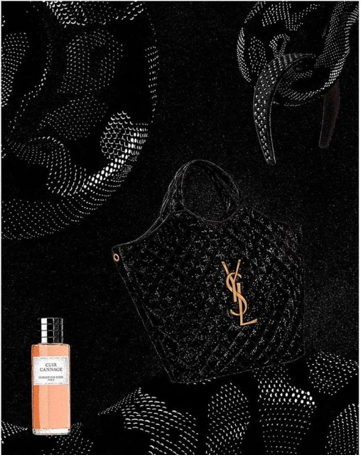 Black quilted handbag with gold YSL logo, perfume bottle, and jewelry on a black background with repeating white dot patterns.