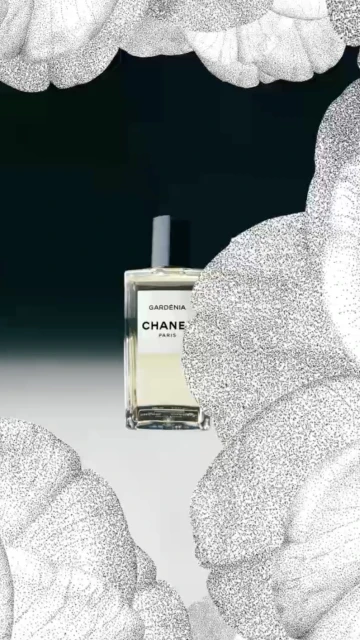 Chanel Gardenia perfume bottle against a dark backdrop, adorned with a floral pattern, creating a luxurious and elegant beauty still life.