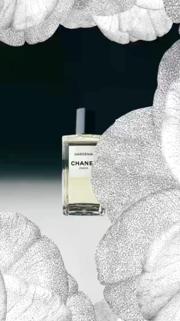 Chanel Gardenia perfume bottle against a dark backdrop, adorned with a floral pattern, creating a luxurious and elegant beauty still life.