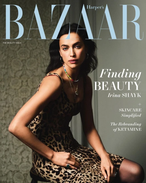 Magazine cover featuring Irina Shayk in an animal-print dress, seated, with Bazaar masthead and article titles in sans-serif typography.
