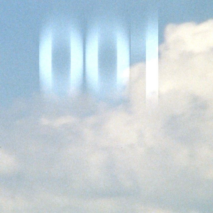 Abstract shot of white and pale blue clouds, featuring a blurred column effect overlaying the sky.