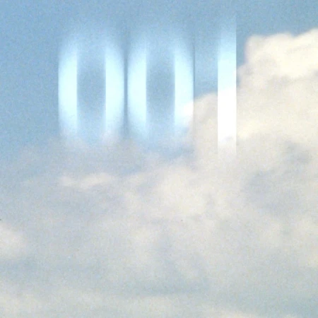 Abstract shot of white and pale blue clouds, featuring a blurred column effect overlaying the sky.