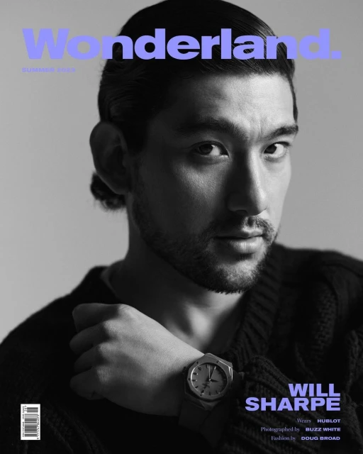 Magazine cover portrait of Will Sharpe in a black and white, with the title 'Wonderland' in blue, featuring a prominent wristwatch.