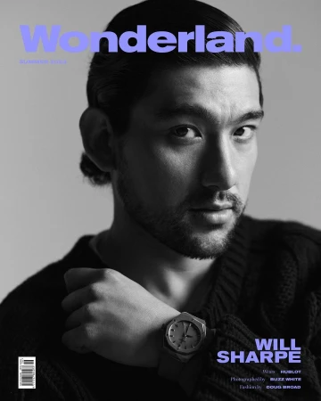 Magazine cover portrait of Will Sharpe in a black and white, with the title 'Wonderland' in blue, featuring a prominent wristwatch.