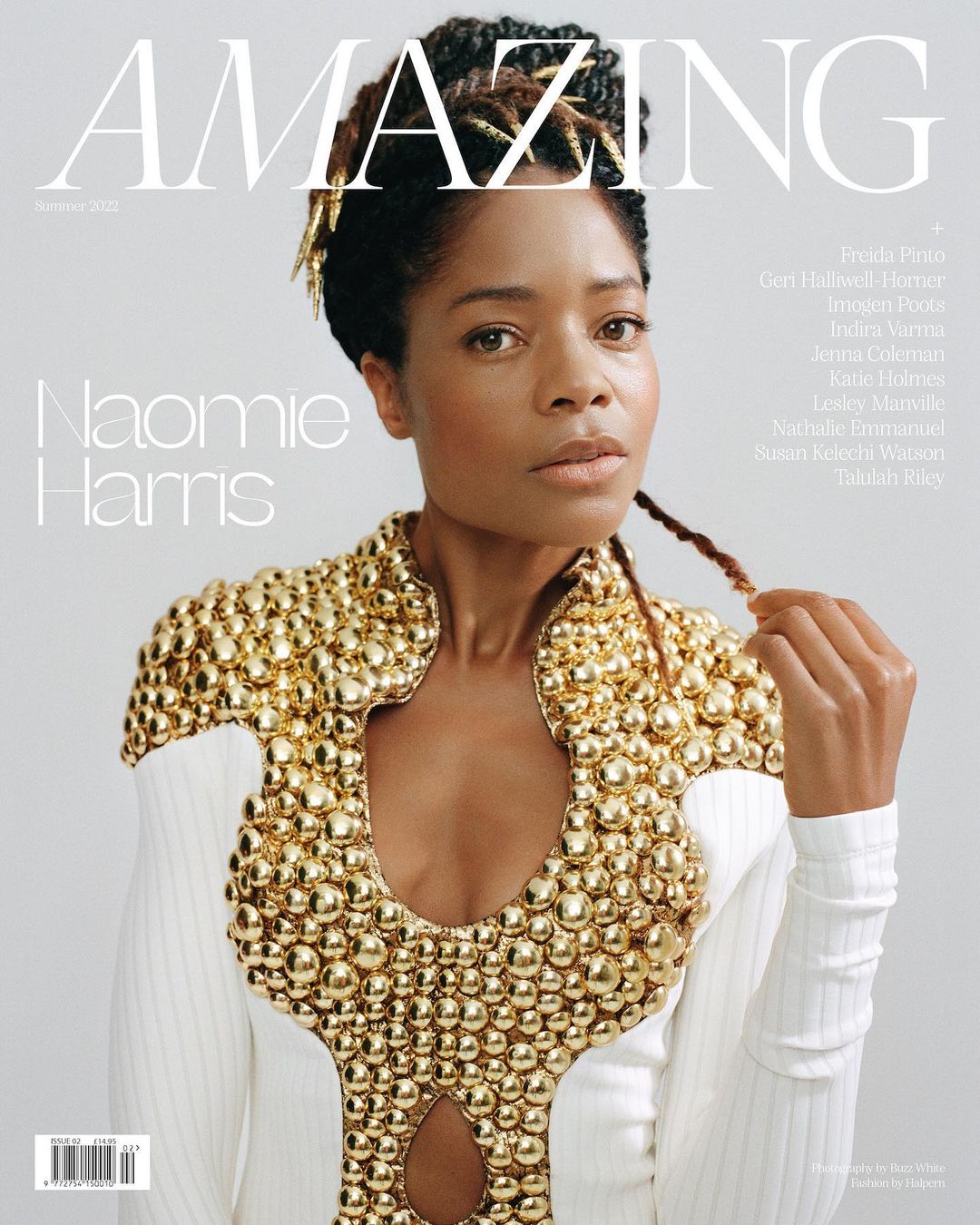 Magazine cover featuring Naomi Harris, wearing a white dress with gold embellishments, in front of a light grey background with text.