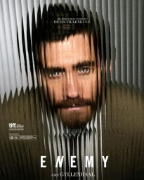 Close-up portrait of Jake Gyllenhaal with his face fractured visually through vertical striped distortion effects.