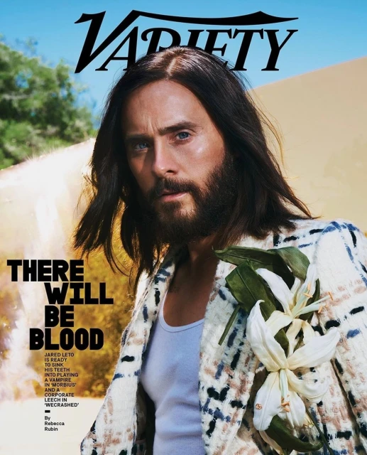Variety magazine cover featuring Jared Leto wearing a patterned blazer and holding flowers, posing against a desert backdrop.