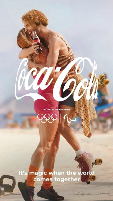 Coca-Cola advertisement featuring a couple hugging while wearing roller skates on a beach, with the Coca-Cola logo prominently displayed.