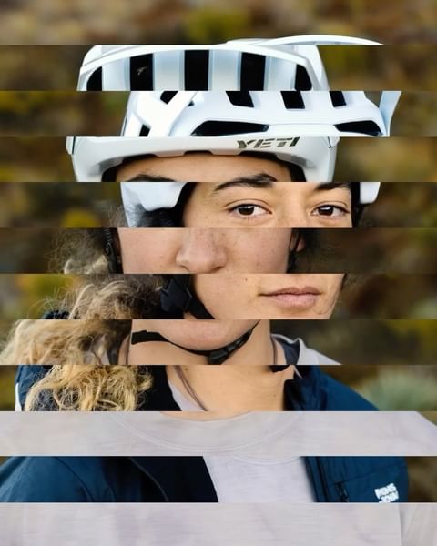 Close-up of a woman in a white helmet with a YETI logo. The shot is spliced with horizontal lines that cut through the face and helmet.