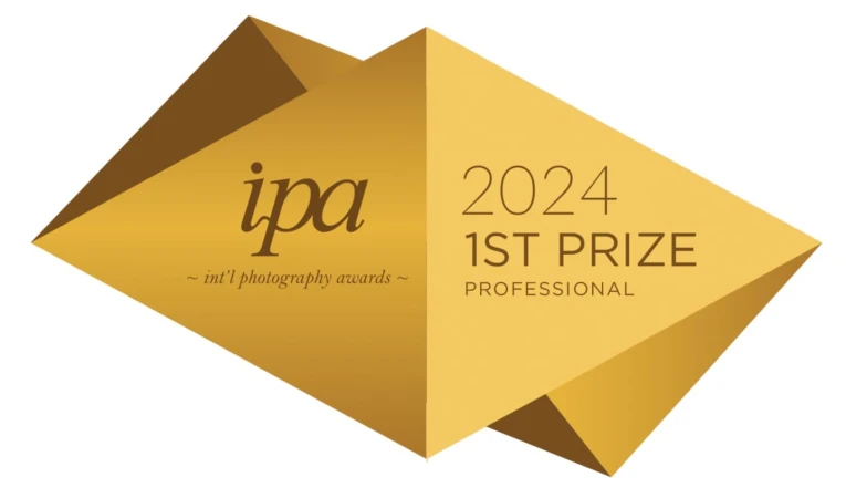 International Photography Awards 2024, 1st Prize Professional award badge in brown and gold on a white background.