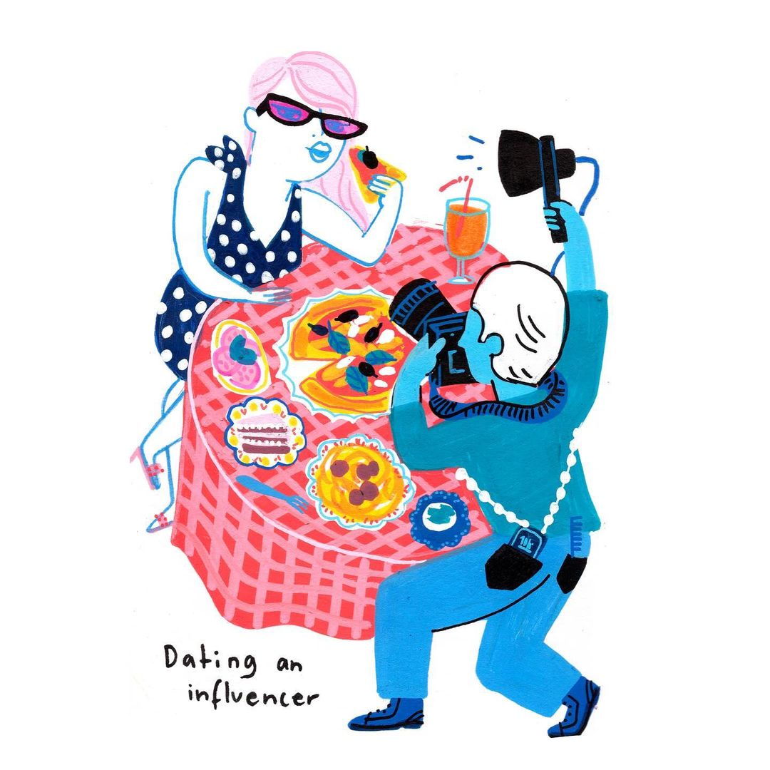 Illustration of a fair-skinned woman with pink hair eating pizza at a table while a photographer in blue takes her picture.