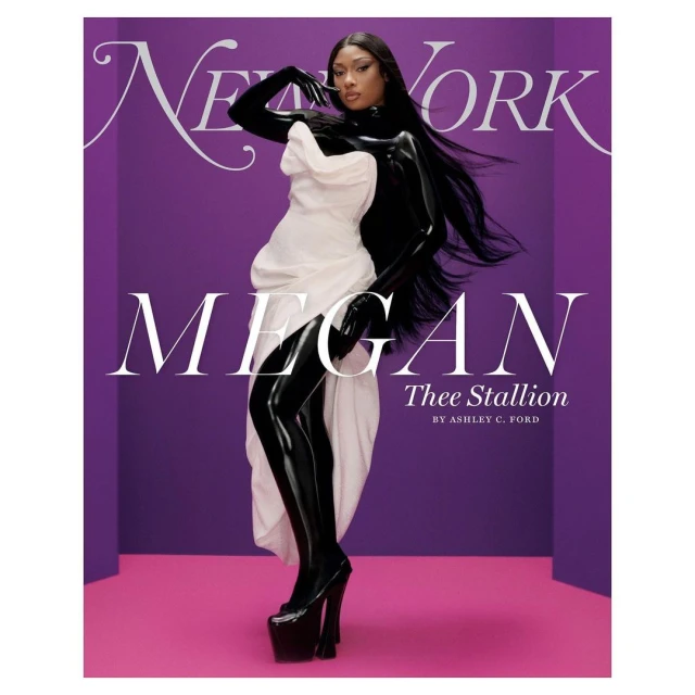 Megan Thee Stallion on New York magazine cover wearing a white dress and black gloves and boots, posing against a purple backdrop.