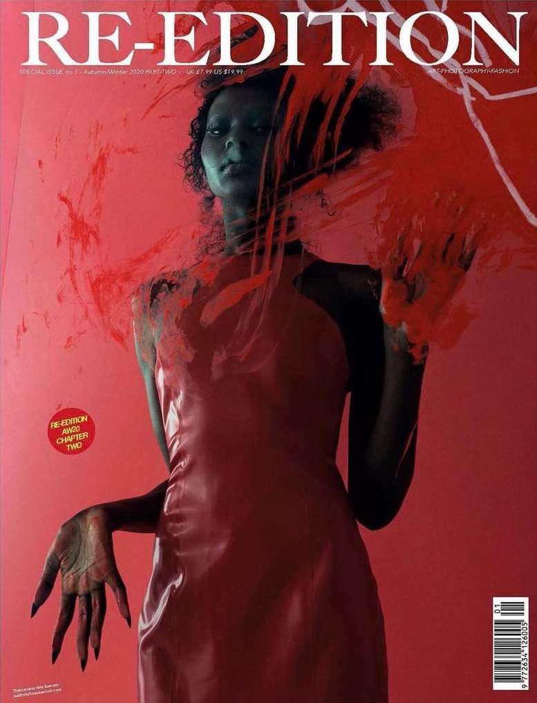 Fashion magazine cover features a Black female model in red dress, with red abstract paint details, against a red studio backdrop.