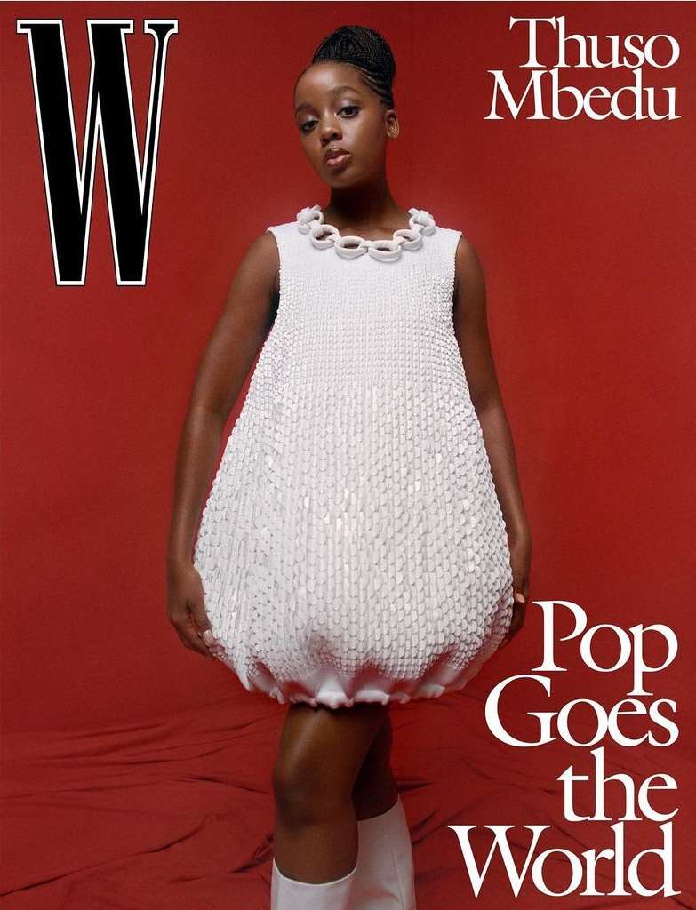 Magazine cover featuring Thuso Mbedu in a white dress, posing against a red background with the 'W' logo and text 'Pop Goes the World'.