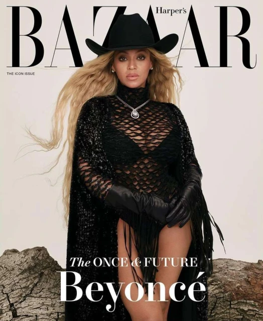 Beyoncé wearing a black cowboy hat and a dark netted outfit on the cover of Harper's Bazaar The Icon Issue.