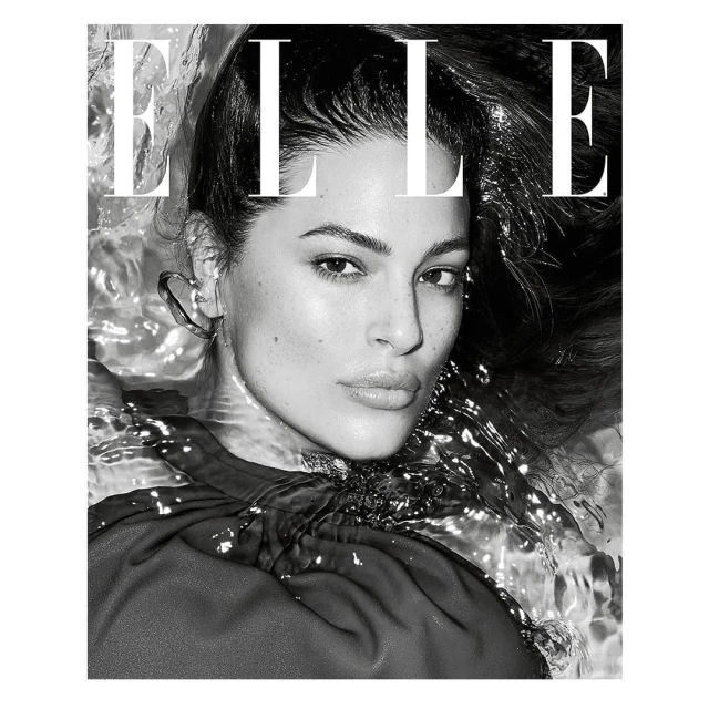 Black-and-white close-up of a model with wet hair and water around her face, as featured on the cover of Elle magazine.