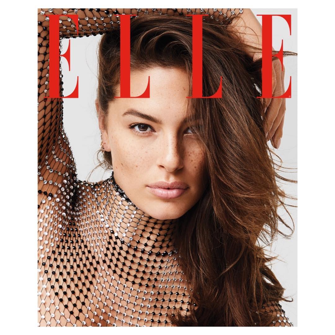 Close-up magazine cover of a woman with brown hair, wearing a glittering mesh top, with red "ELLE" text at the top of the frame.