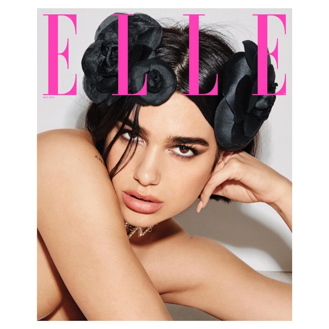 Elle magazine cover featuring a portrait of a woman with dark hair and a floral headpiece, close-up shot with magazine masthead.