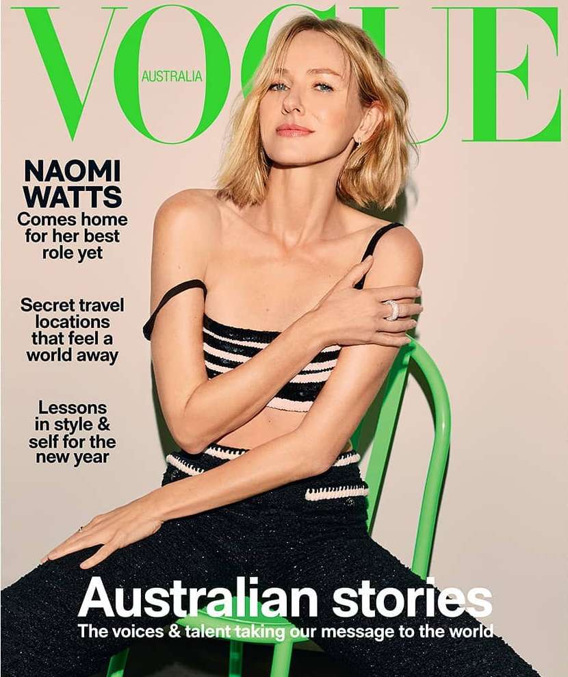 Magazine cover featuring Naomi Watts, Vogue Australia, posing in a striped top and dark pants, sitting on a green chair. Fashion shot.