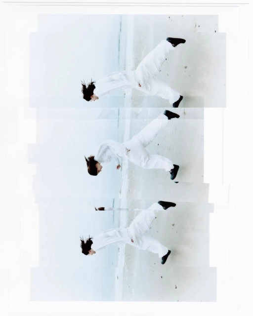 Three images of a woman wearing a white jumpsuit and black shoes, posed mid-air against a concrete surface, top angle, indoor.