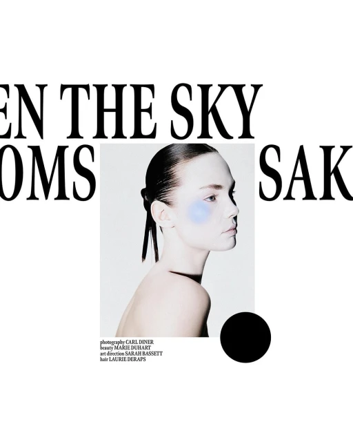 Fashion shot of a model with blue makeup in a white photo studio with black text overlayed spelling out, "When the Sky Blooms"